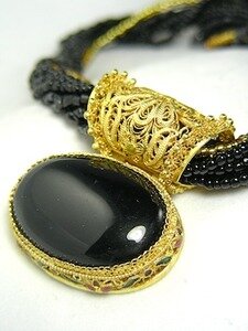 BLACK ONYX OVAL PENDANT ON BLACK & GOLD BEADS BY BARBARA GARWOOD